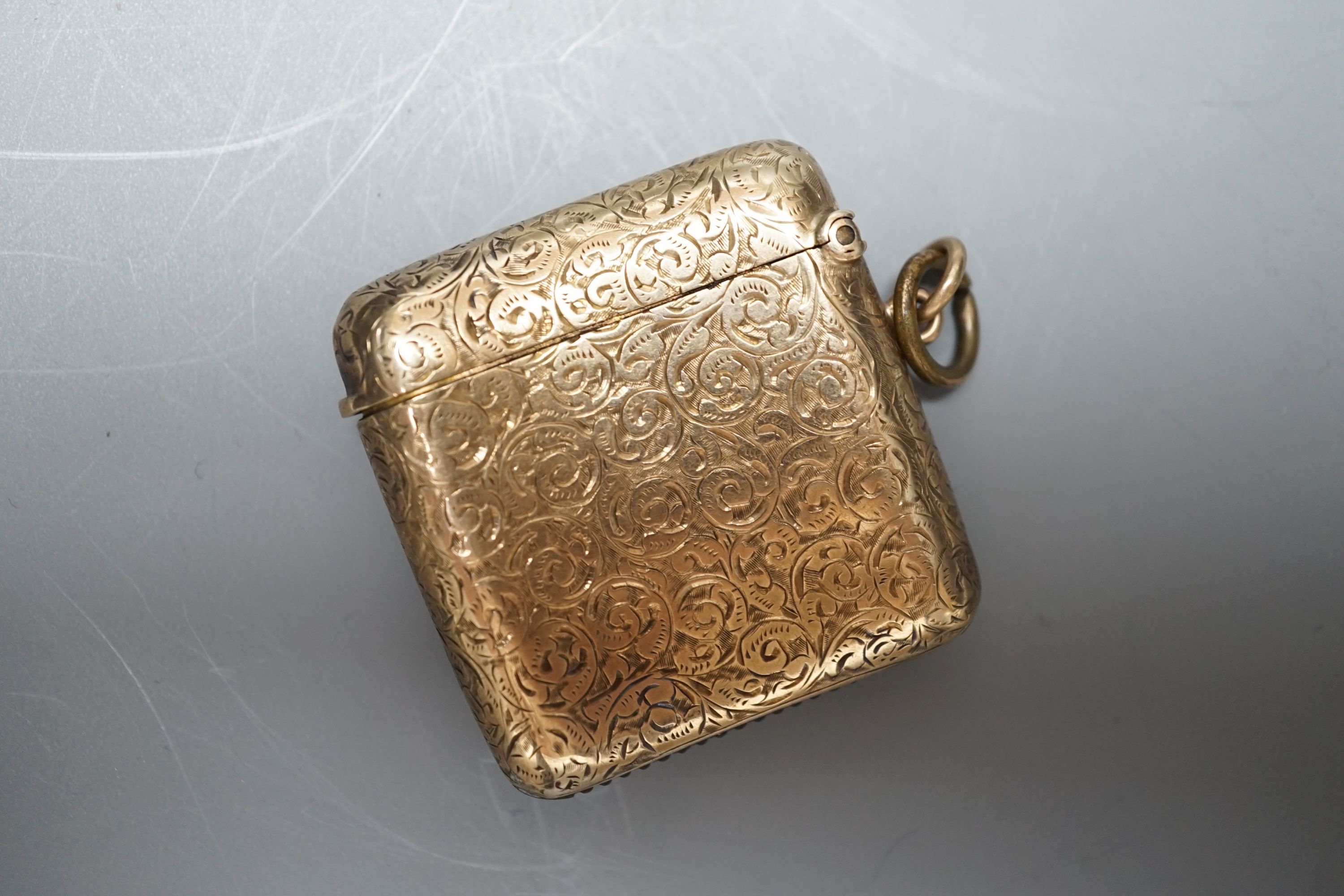 An Edwardian engraved 9ct gold vesta case, by S. Blanckensee & Sons Ltd, Birmingham, 1909, 41mm, gross weight 20.5 grams.